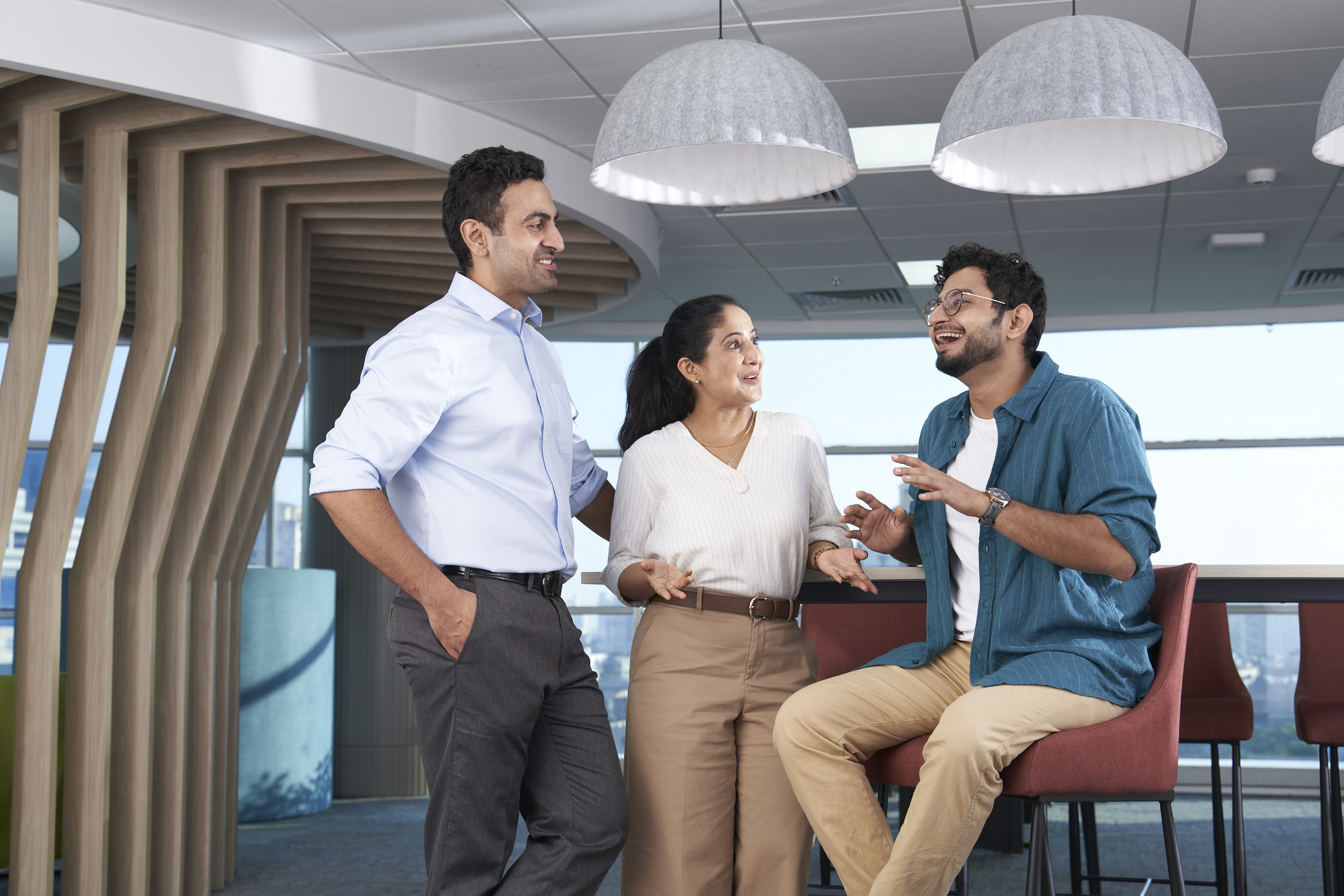 Orange employees gathered around a work table