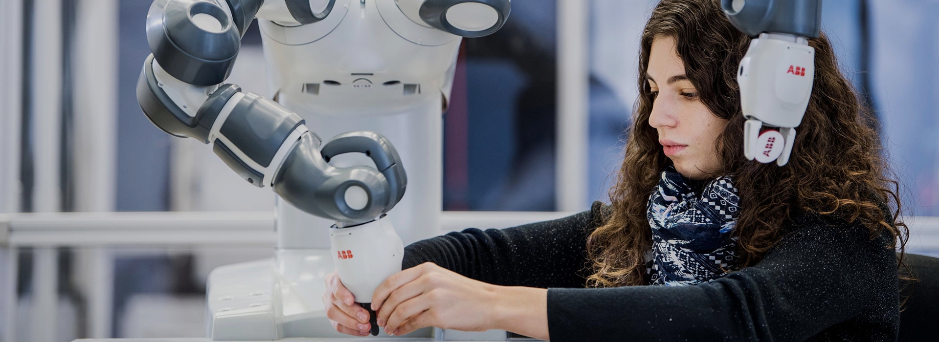 Woman working with an ABB Robot