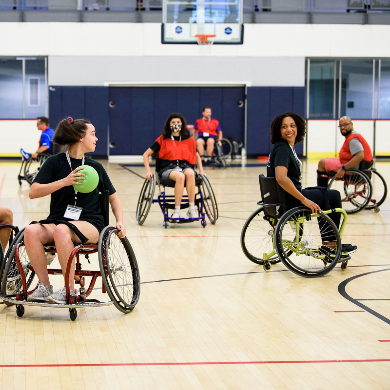 Mollie (left), Shalaka (middle), and Gabrielle (right) playing wheelchair handball.  