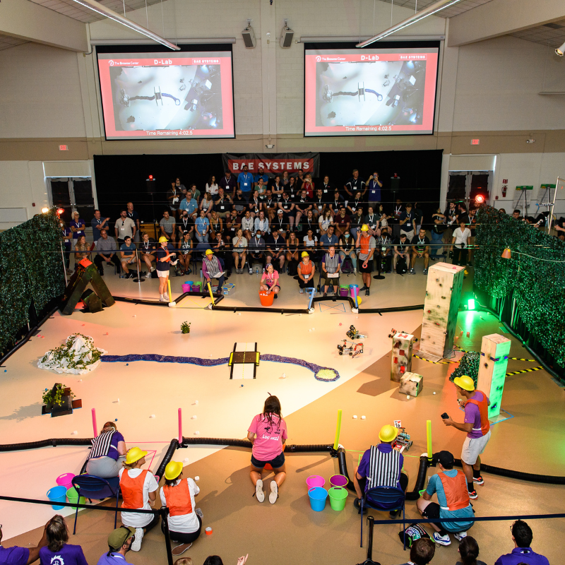 An aerial view of the developmental lab arena including obstacles and landing zones for rovers to deliver objects to.