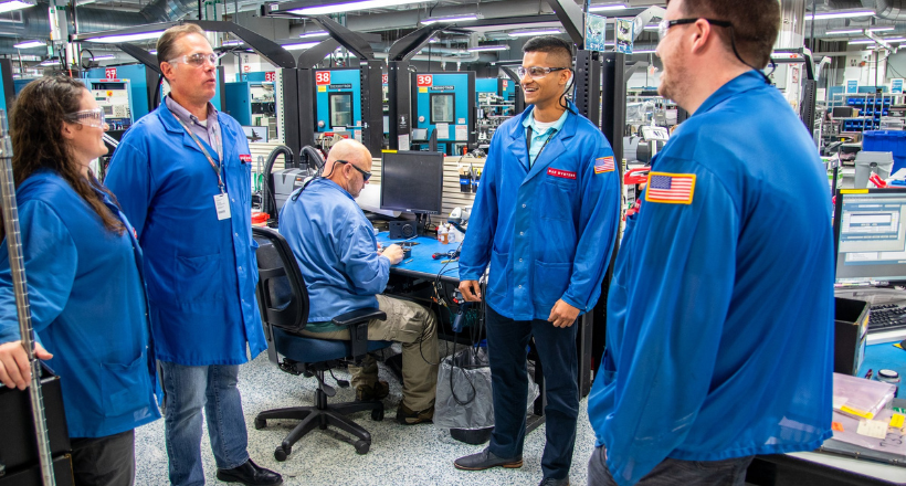 Four test technicians in the Endicott operations center.