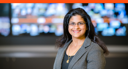 Neeta, a BAE Systems program director, smiles for a headshot.