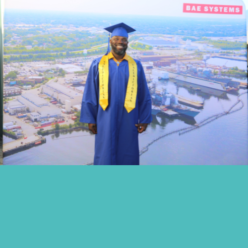 Antoine, the valedictorian of the 2022 Norfolk Ship Repair apprenticeship program, poses for a photo in his gap and gown.