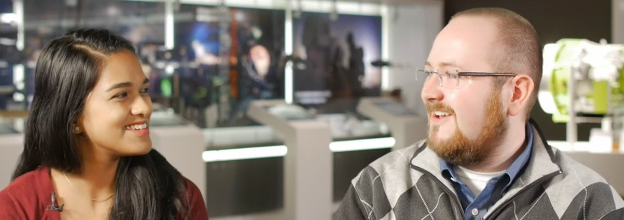 Two co-workers smiling during a duel interview.