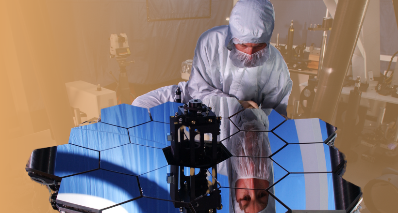 An employee from the space and mission systems sector working on some test equipment for the James Webb Space Telescope.