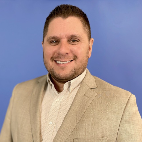 Chad Franz, BAE Systems talent acquisition specialist, smiles for a professional headshot