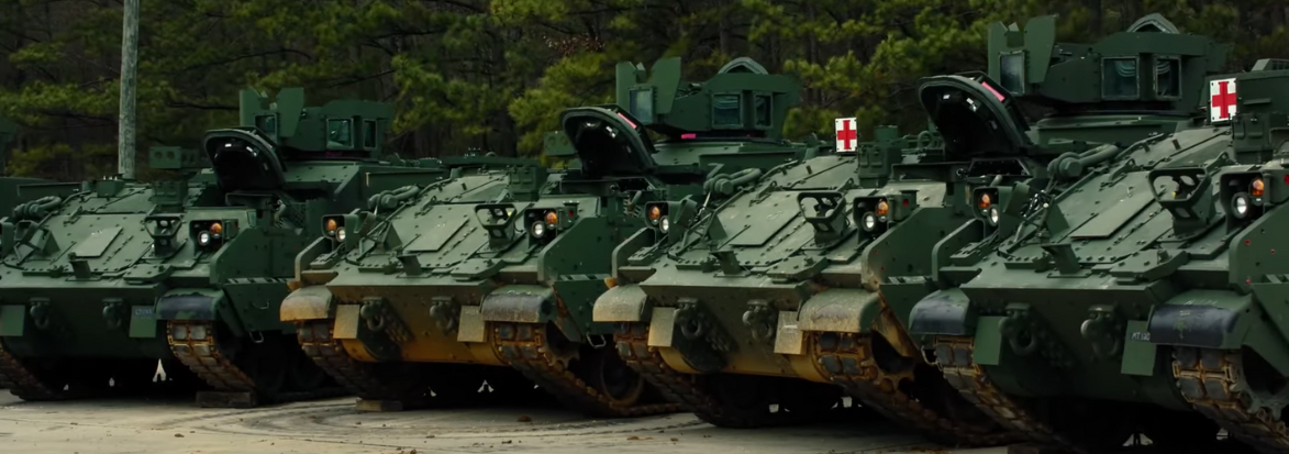 Four Armored Multi-Purpose Vehicles (AMPV) lined up. Click to watch the video.