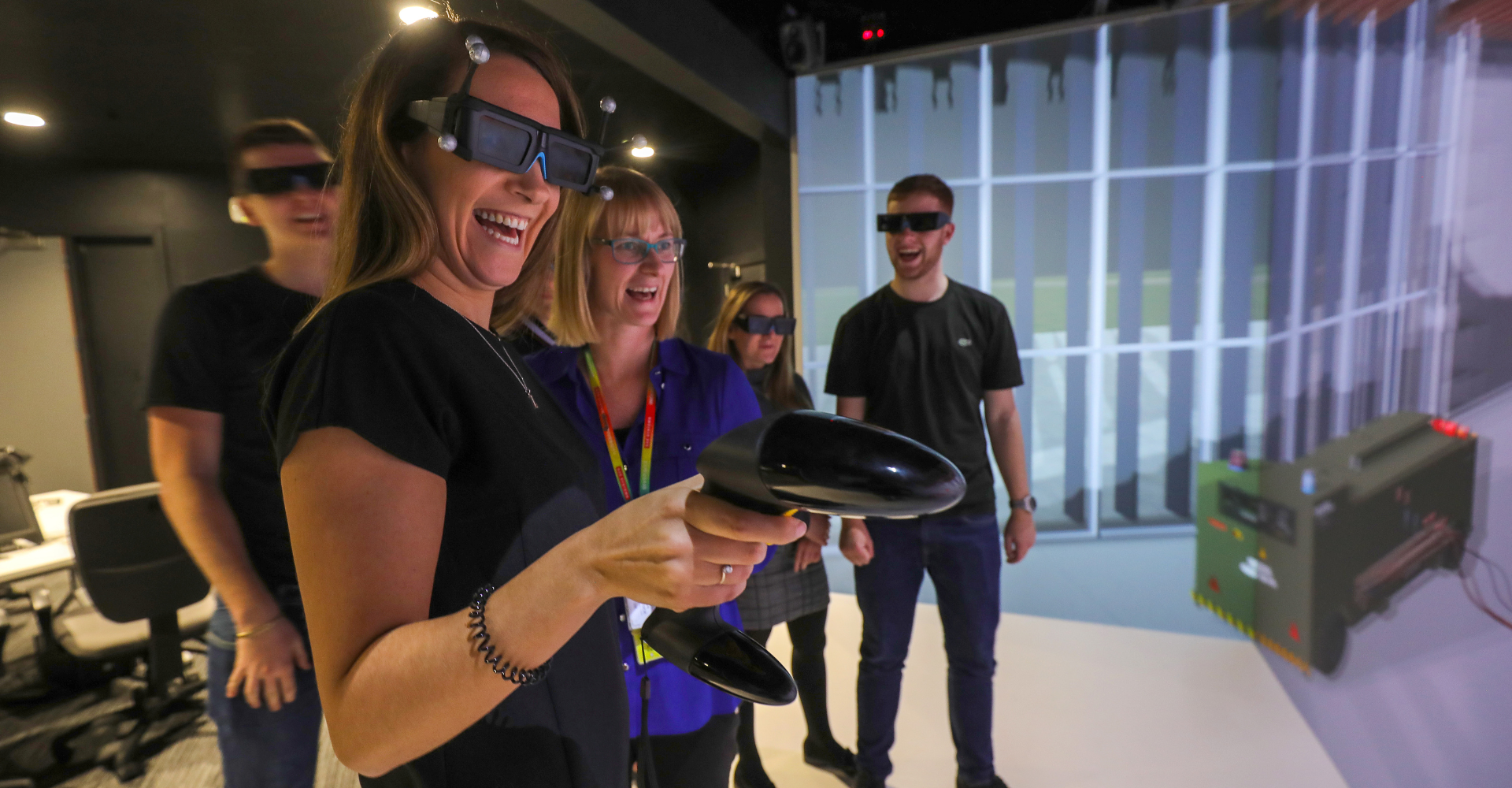 Interns and mentor experiencing virtual reality. 