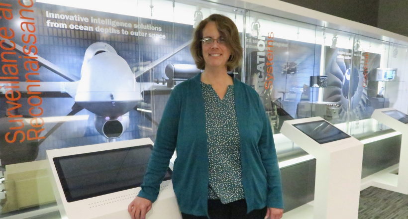 Kathy, a boomerang employee, poses for a photo at the Nashua, NH office.