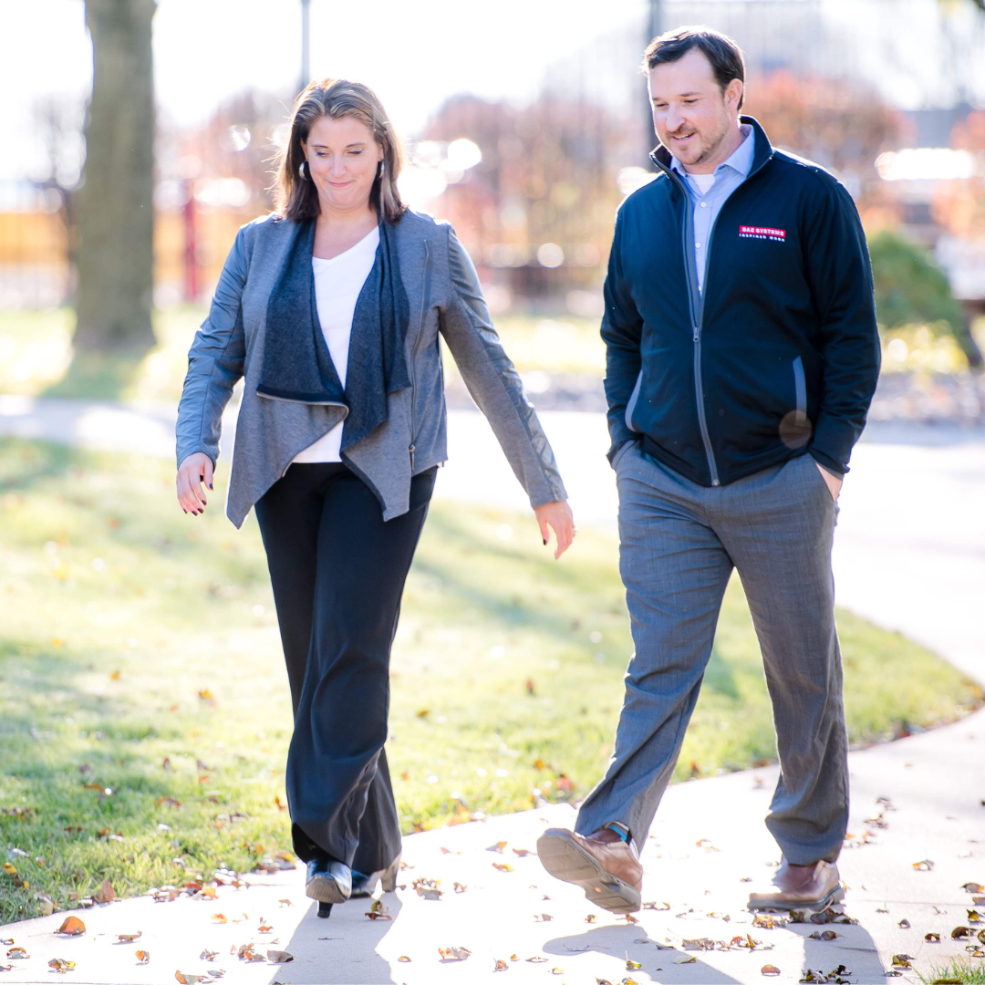 Two employees taking a walking around the York campus.