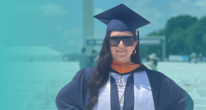 Gabriella, manager of internal audit at BAE Systems, poses in her cap and gown at her graduation ceremony from George Washington University.