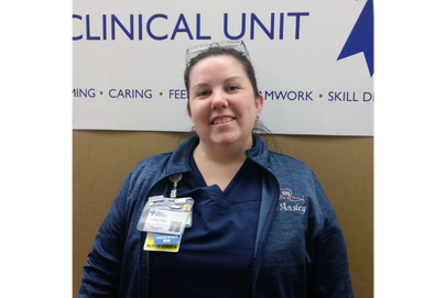 Registered Nurse smiling and looking at camera.