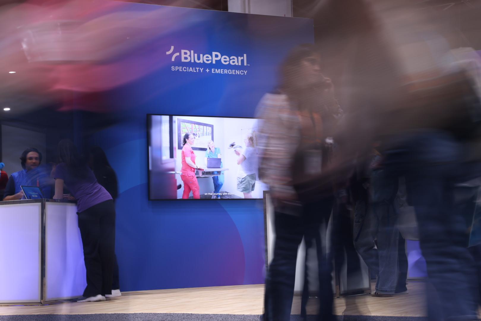 A time-lapse shot of people walking in the BluePearl booth at IVECCS 2026.