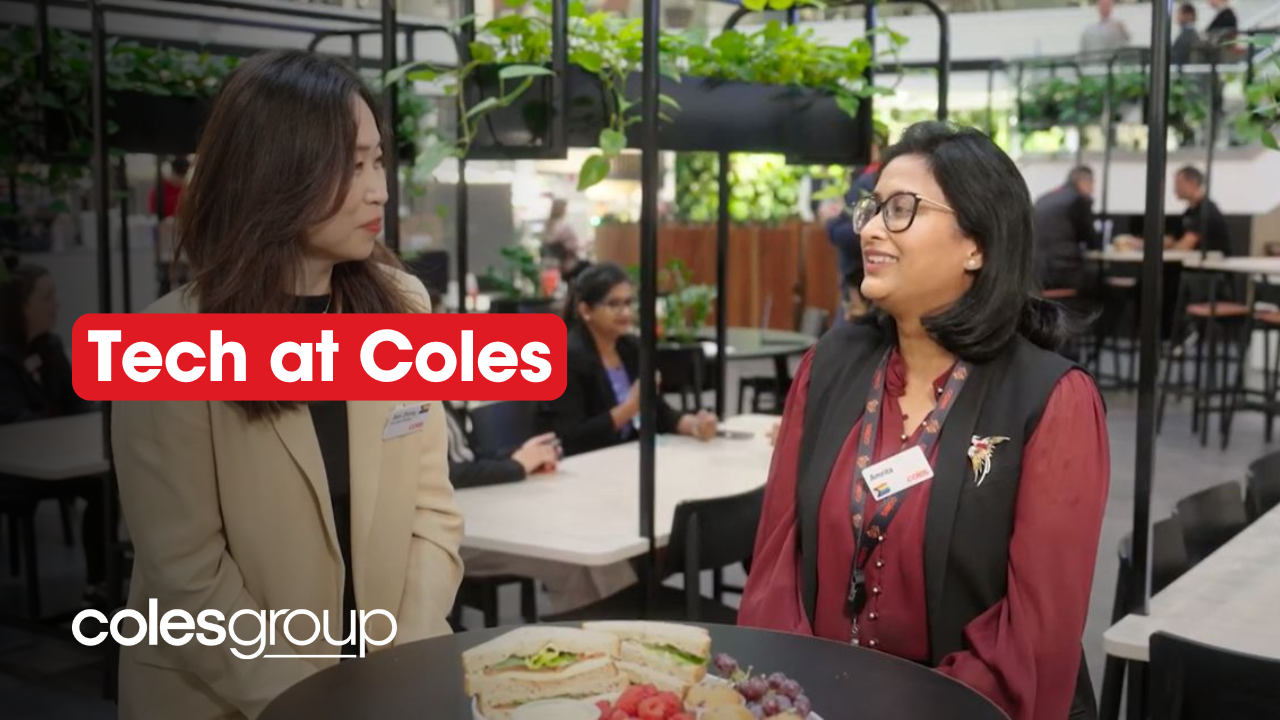 Two female team members in tech having a conversation at the SSC Hub