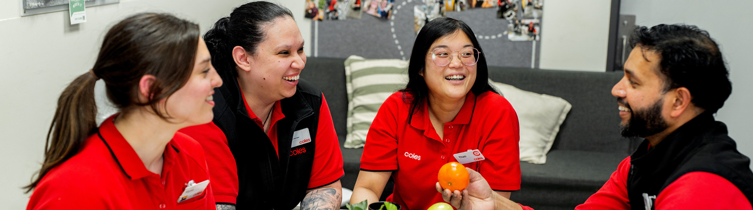 A group of Coles team members spending time together in a staff lunch room