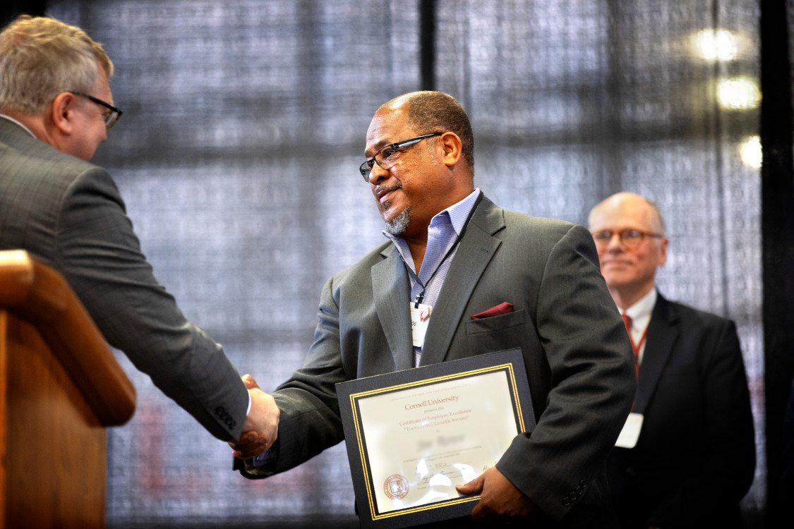 Cornell staff member receiving an employee award