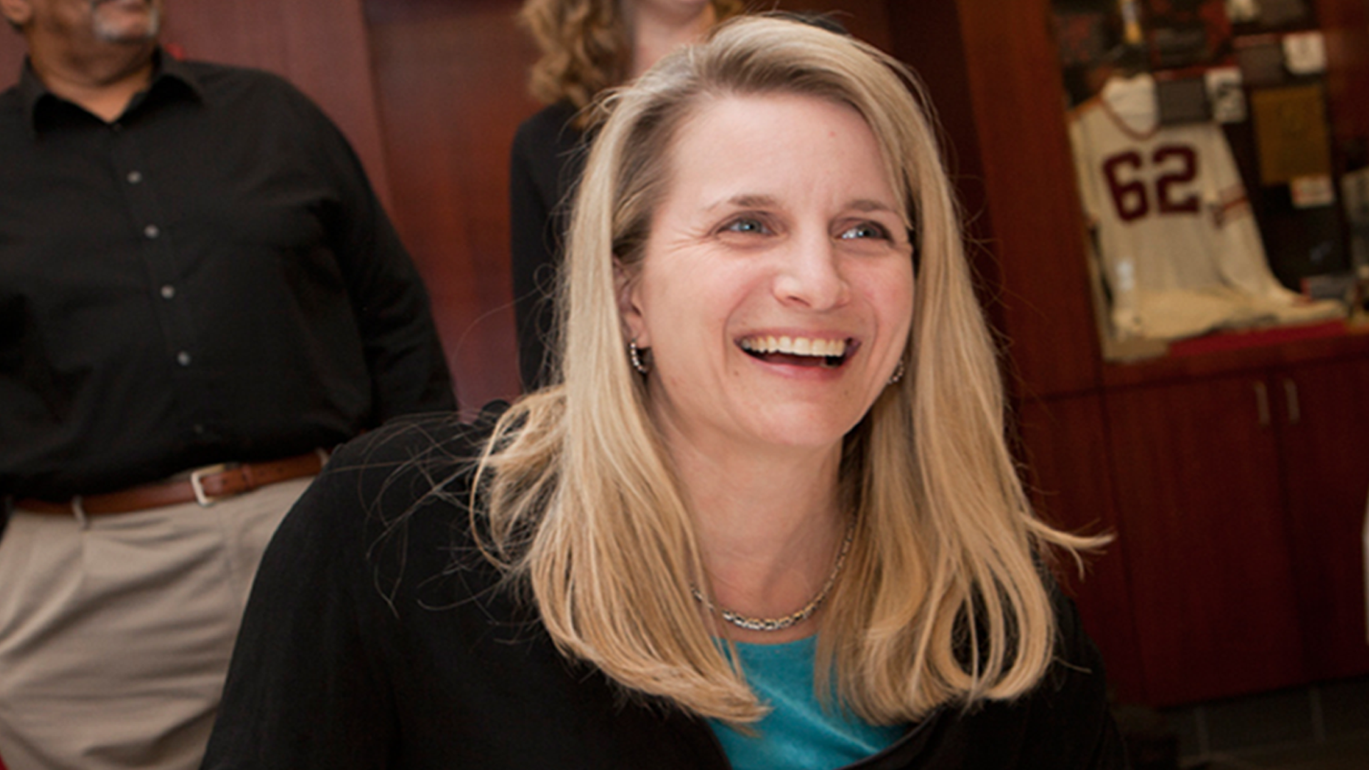 Andrea Haenlin-Mott smiling looking off camera