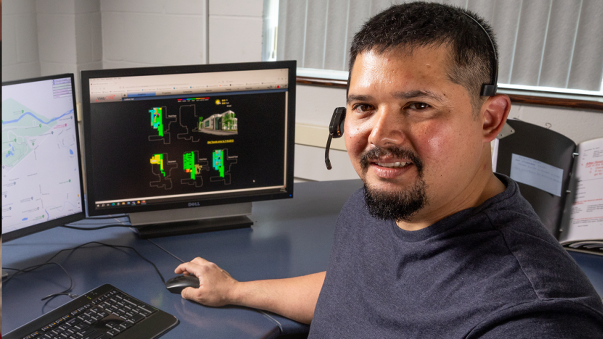 Carlos-Ribellia at his desk with computer monitors
