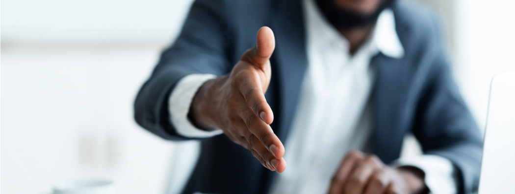 Black man extending hand in greeting