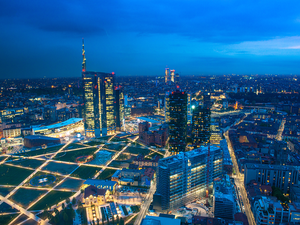 Night time birds-eye view of Milan Italy