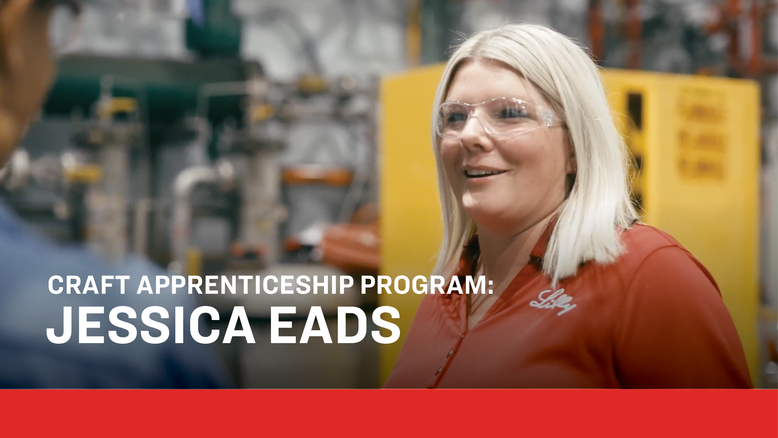 A professional in safety glasses and a red Lilly shirt stands in a pharmaceutical manufacturing setting surrounded by industrial equipment. Text overlay reads: “Craft Apprenticeship Program: Jessica Eads,” highlighting skilled career pathways in medicine production.