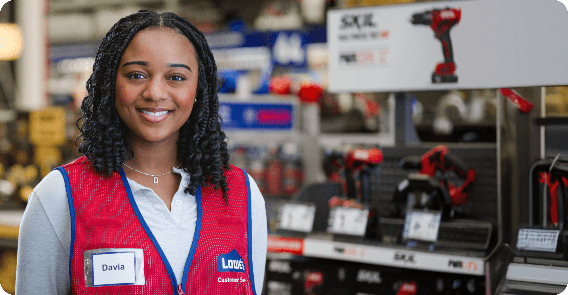 Lowe's associate working happily in the Tools department