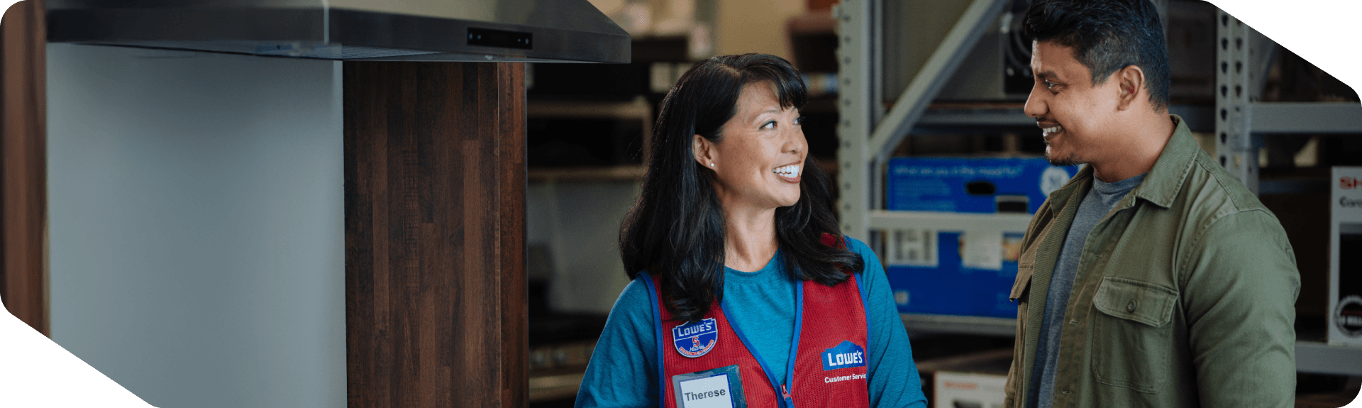 Lowe's associate assisting a customer with product questions