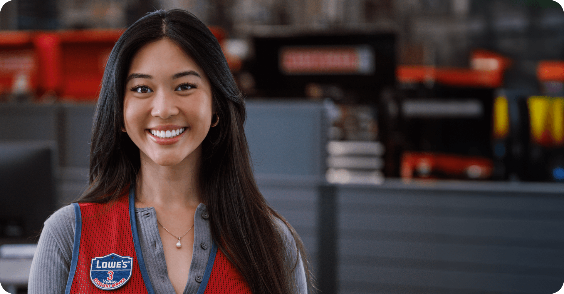 Lowe's Cashier smiling while working the register
