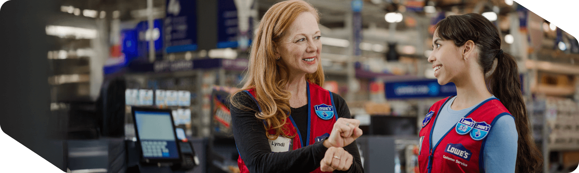 Two Lowe's associates working together and using sign language to communicate