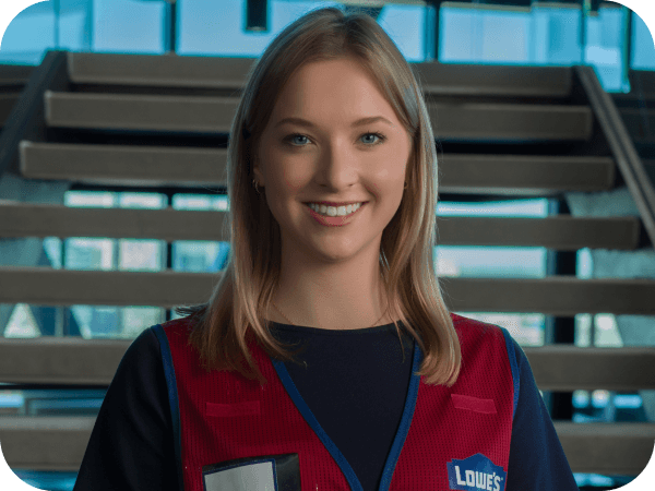 Corporate associate standing in front of stairs at the Tech Hub