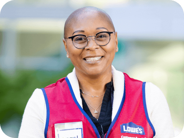 Corporate associate standing outside of corporate headquarters