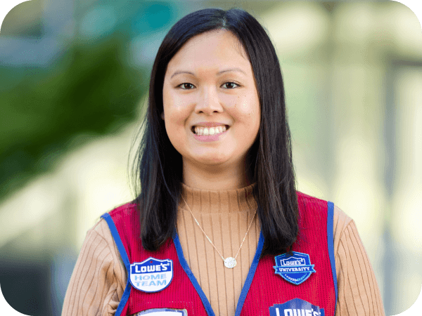 Corporate associate standing outside of corporate headquarters