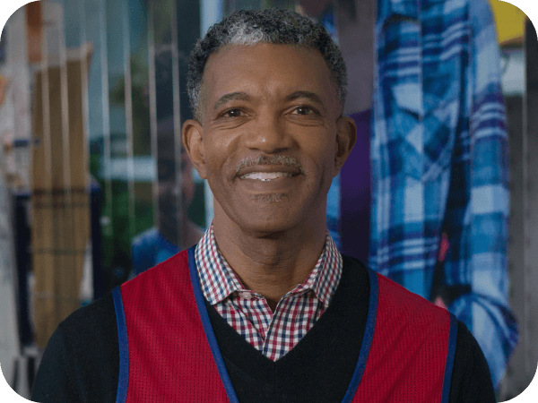 Corporate associate standing in front of a mural at corporate headquarters