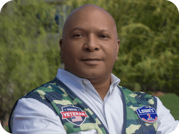 Corporate associate standing confidently outside of corporate headquarters
