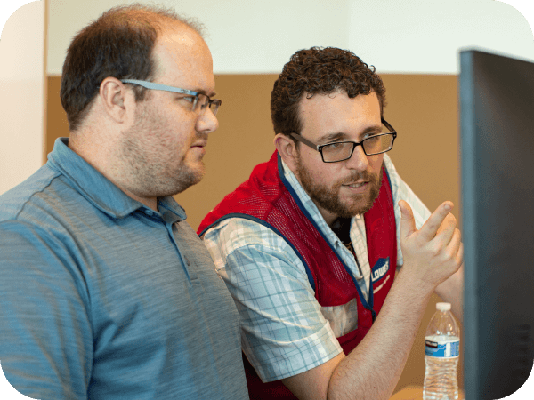 Tech trainer assisting a colleague