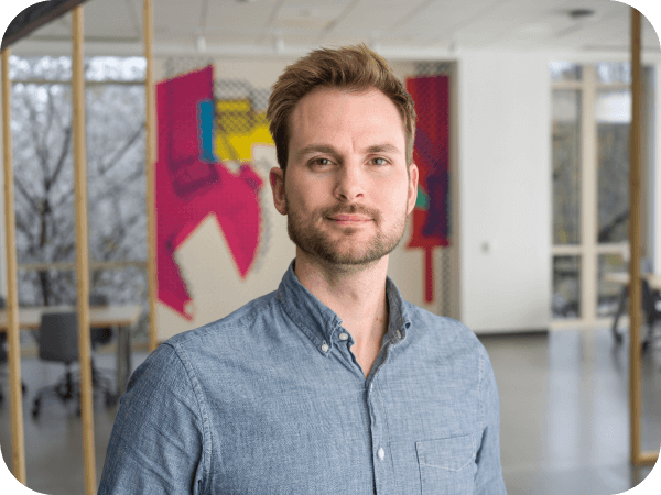 Lowe's corporate associate standing in an open workspace at Corporate headquarters