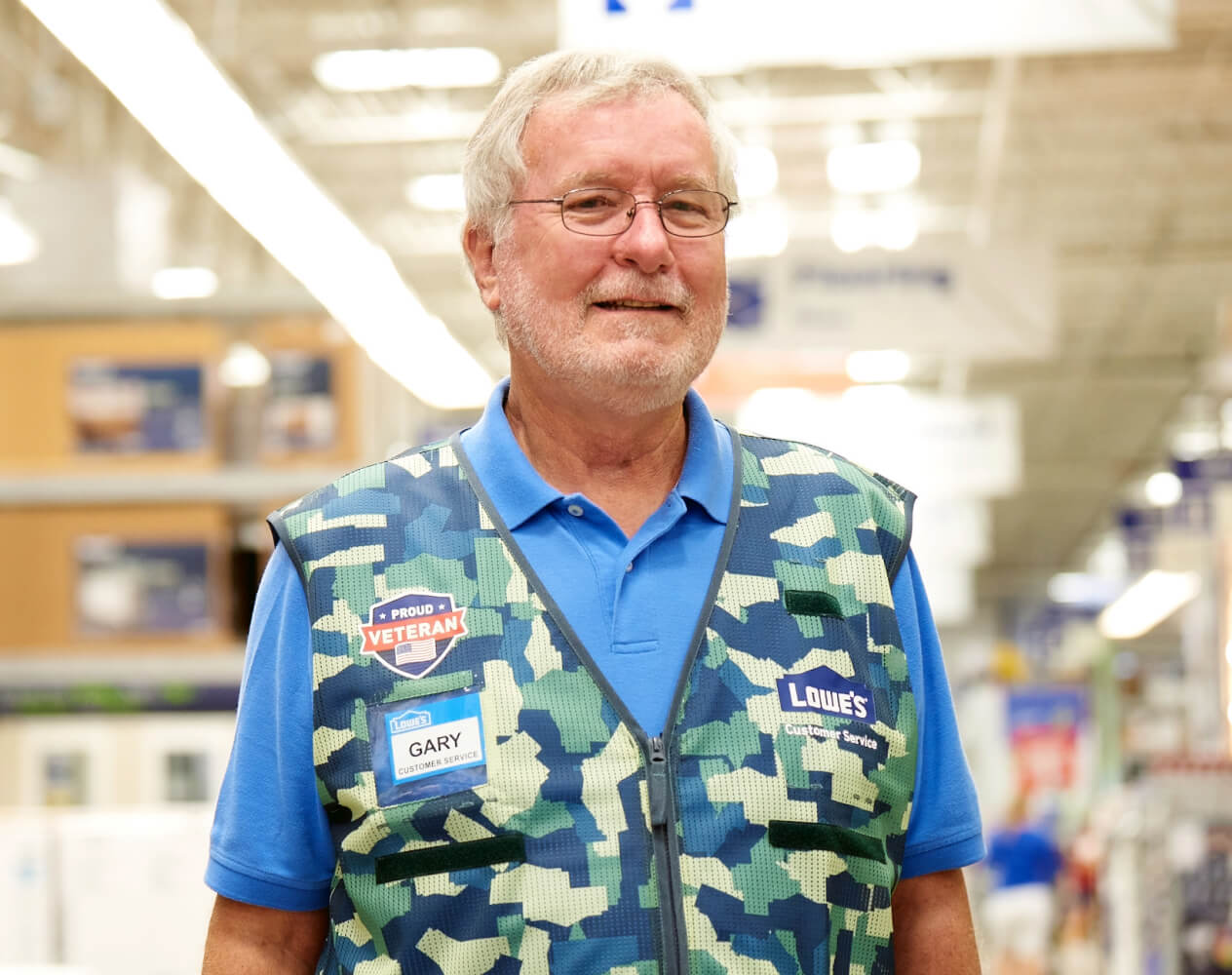 Male associate wearing a military vest