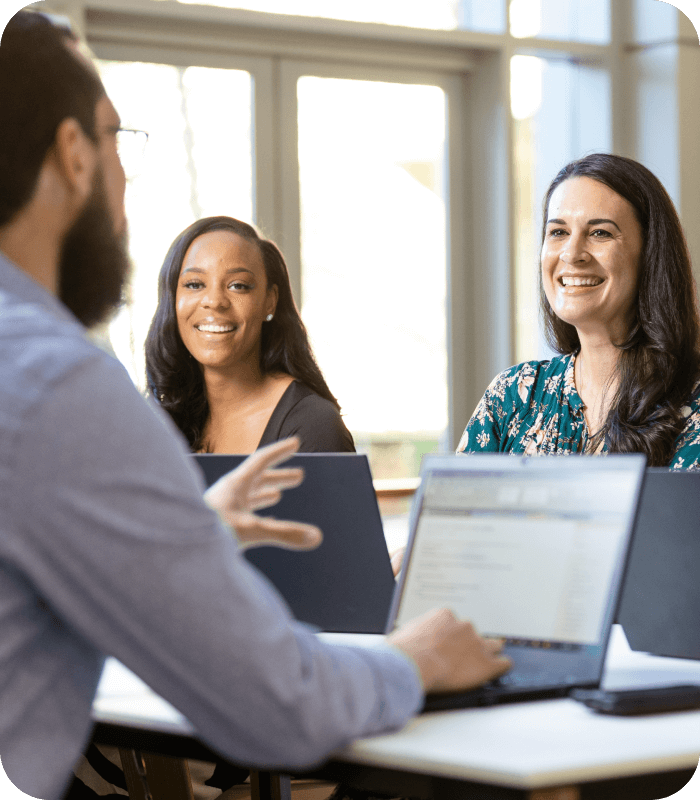 Lowe's Corporate associates interacting during a team meeting