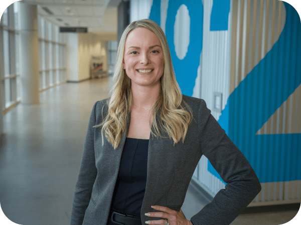 Lowe's associate standing in a hallway of Corporate headquarters