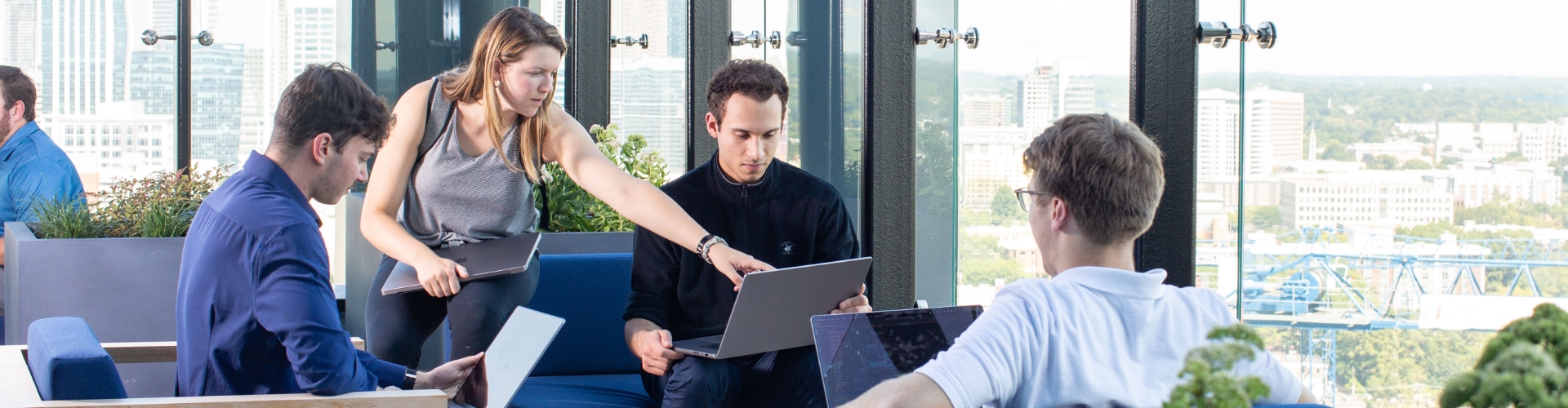 Associates working together outside at the Tech Hub