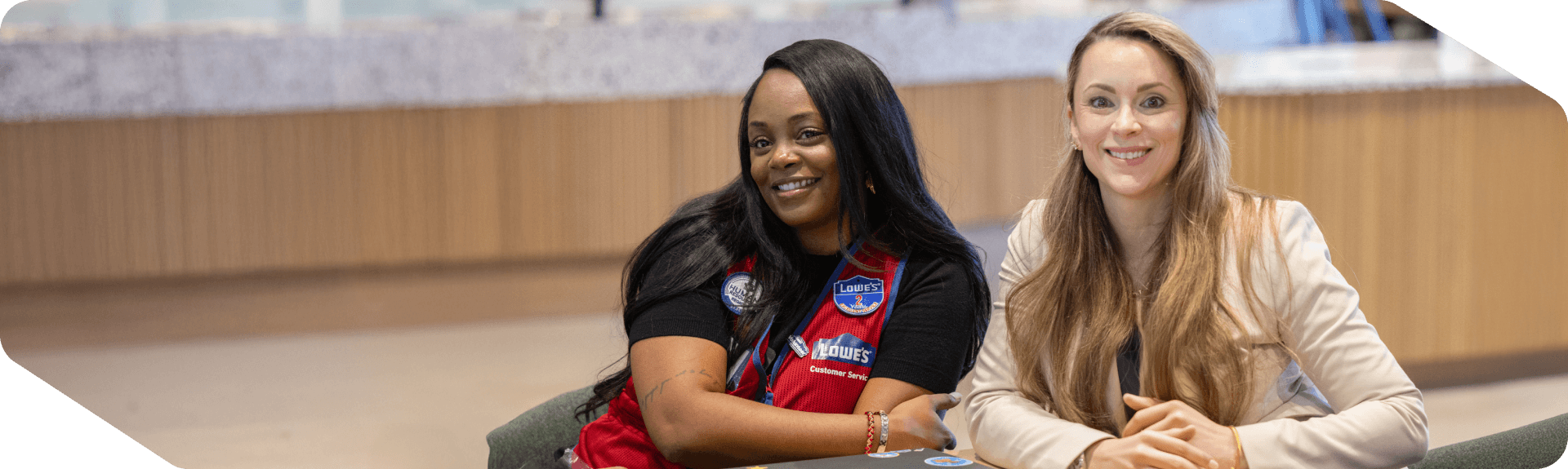 Two Lowe's associates networking at the Inclusion Network event