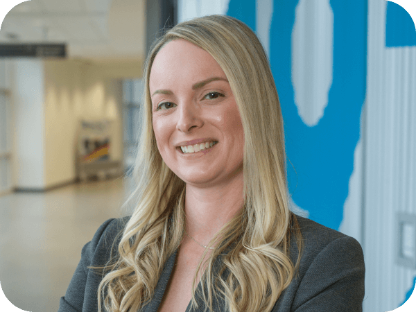 Lowe's associate standing in a hallway of Corporate Headquarters