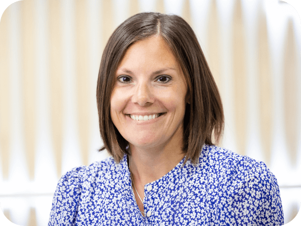 Corporate associate smiling during a meeting