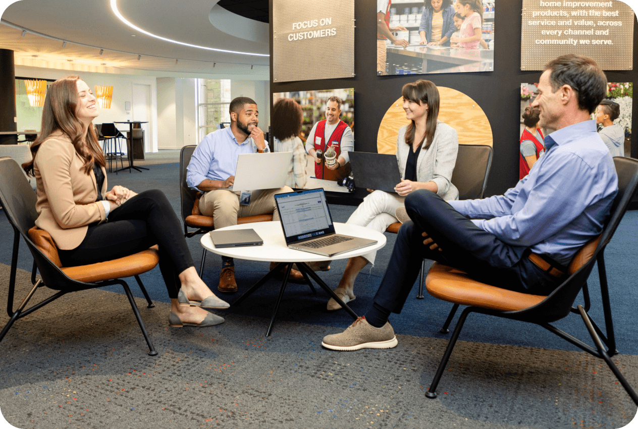 Lowe's corporate associates having a meeting in an open workspace at headquarters