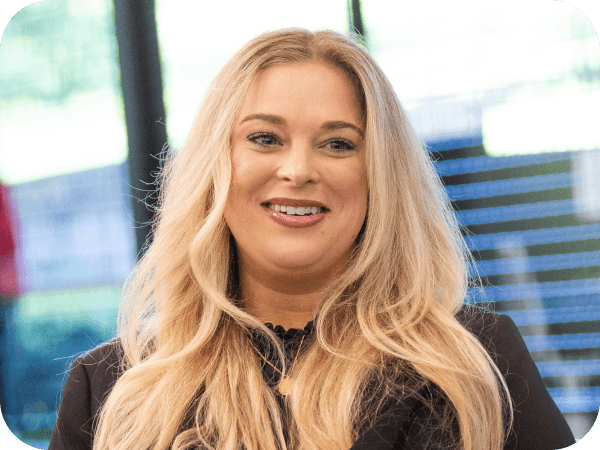 Corporate associate smiling having a conversation with a colleague