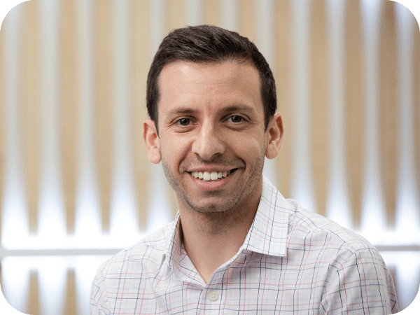 Corporate associate smiling while in a conference room
