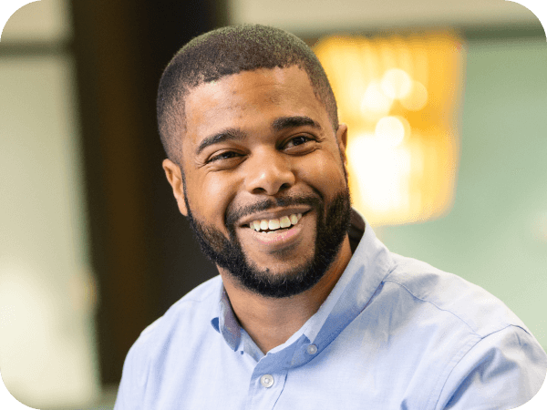 Corporate associate having an enthusiastic conversation with a team member