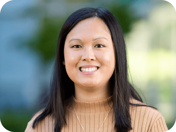 Lowe’s team member smiling while working outdoors.