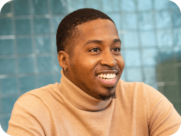 Corporate Lowe's associate smiling while engaging in a meeting