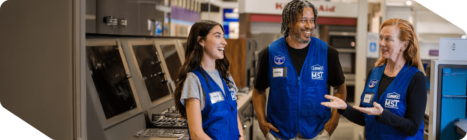 Lowe's MST associates meeting together in the Appliances department